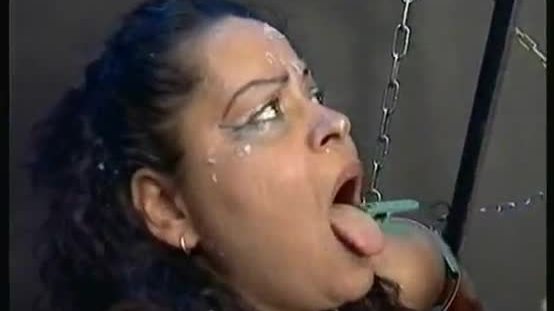 Screaming ebony slave is hit on her big boobs and got her tits and face covered with clamps